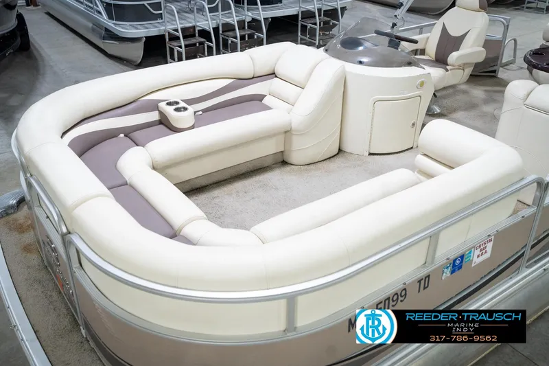 Slide: The Image of 2008 Bennington 20 SL pontoon boat with plush seating and steering console. - 12