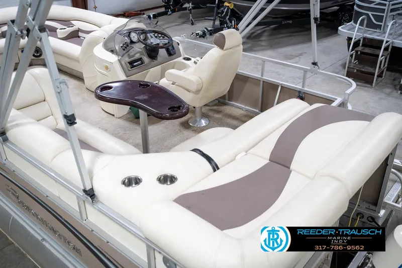 Slide: The Image of 2008 Bennington 20 SL pontoon boat interior with plush seating and control console. - 15