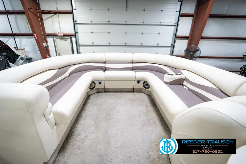 Slide: The Image of Luxurious seating on a 2008 Bennington 20 SL pontoon boat in a spacious garage. - 19