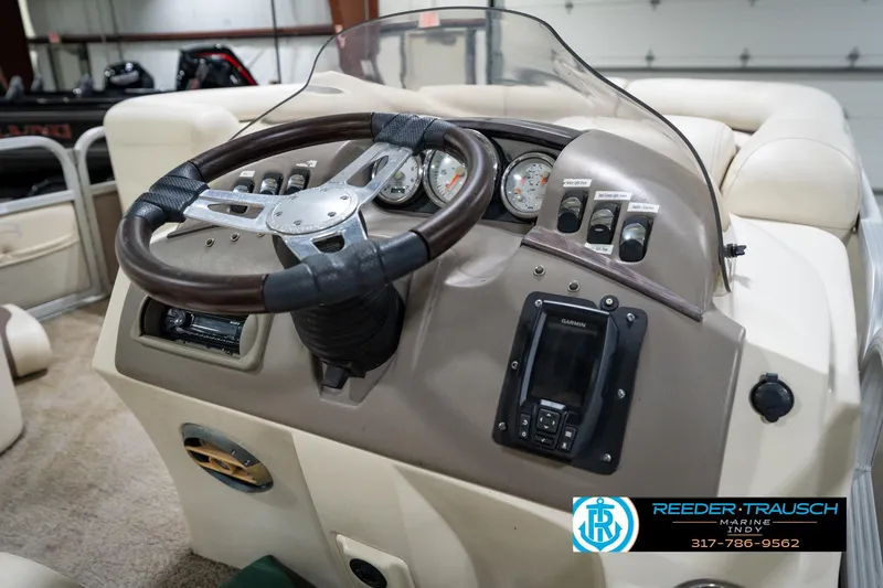Slide: The Image of Steering console of a 2008 Bennington 20 SL boat with gauges and Garmin device. - 24