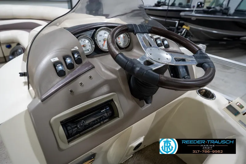 Slide: The Image of Dashboard of a 2008 Bennington 20 SL boat with steering wheel and gauges. - 25