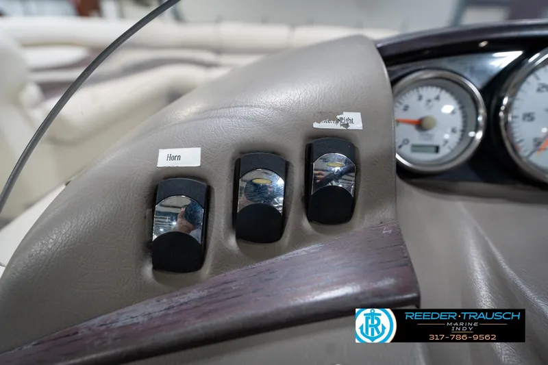 Slide: The Image of Dashboard of a 2008 Bennington 20 SL boat with switches and gauges. - 29