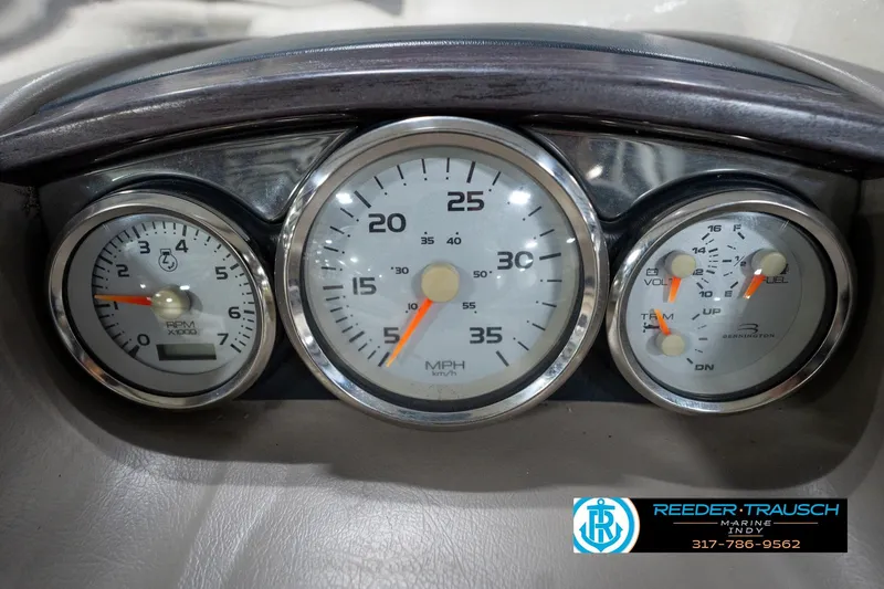 Slide: The Image of Dashboard gauges of a 2008 Bennington 20 SL boat, showing speed, RPM, and fuel levels. - 30