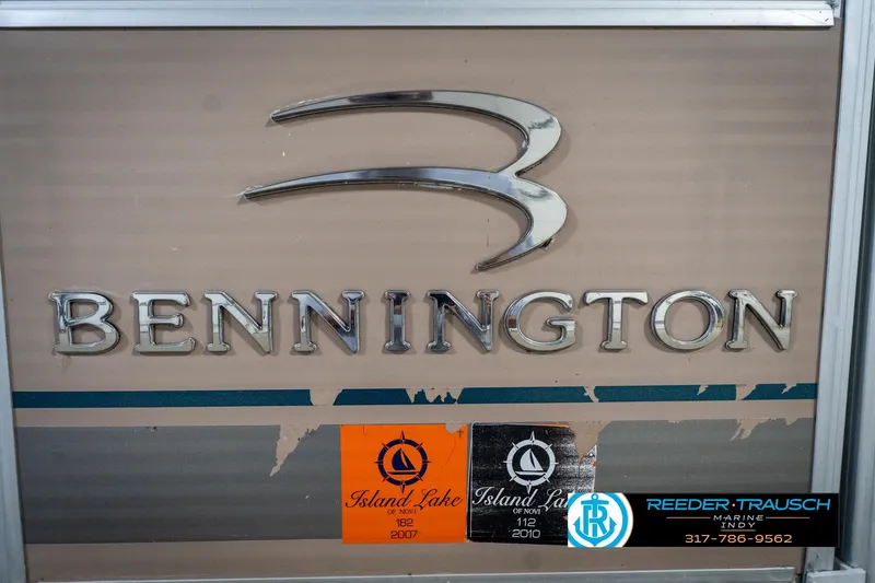 Slide: The Image of Bennington 20 SL 2008 boat logo with Island Lake stickers and Reeder-Trausch Marine contact. - 40