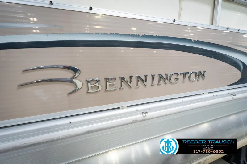 Slide: The Image of 2008 Bennington 20 SL boat side view with logo and dealership contact. - 41