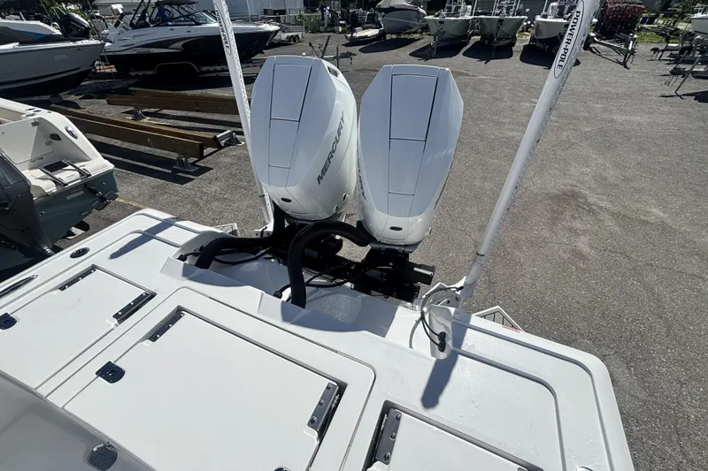 Slide: The Image of 2026 Tidewater 3100 Carolina Bay boat with dual Mercury outboard engines. - 10
