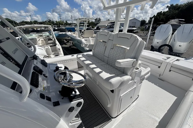 Slide: The Image of 2026 Tidewater 3100 Carolina Bay boat interior with dual seats and steering console. - 21
