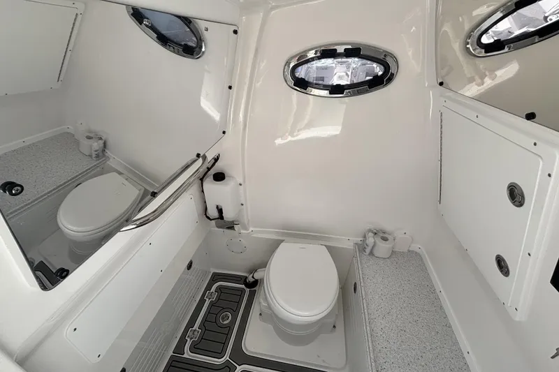 Slide: The Image of 2026 Tidewater 3100 Carolina Bay boat interior with modern bathroom amenities. - 27