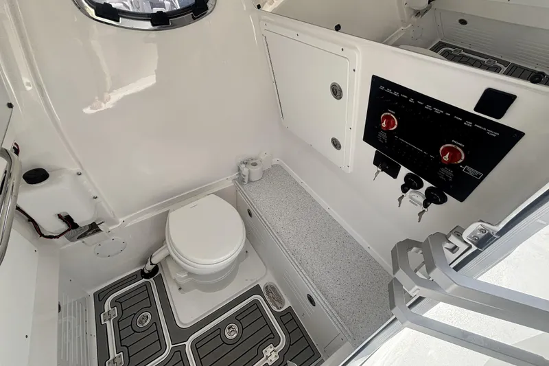 Slide: The Image of 2026 Tidewater 3100 Carolina Bay boat interior with toilet and control panel. - 28