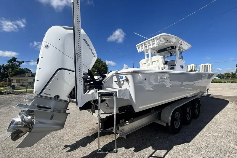 Slide: The Image of 2026 Tidewater 3100 Carolina Bay boat with Mercury engine on a trailer. - 9