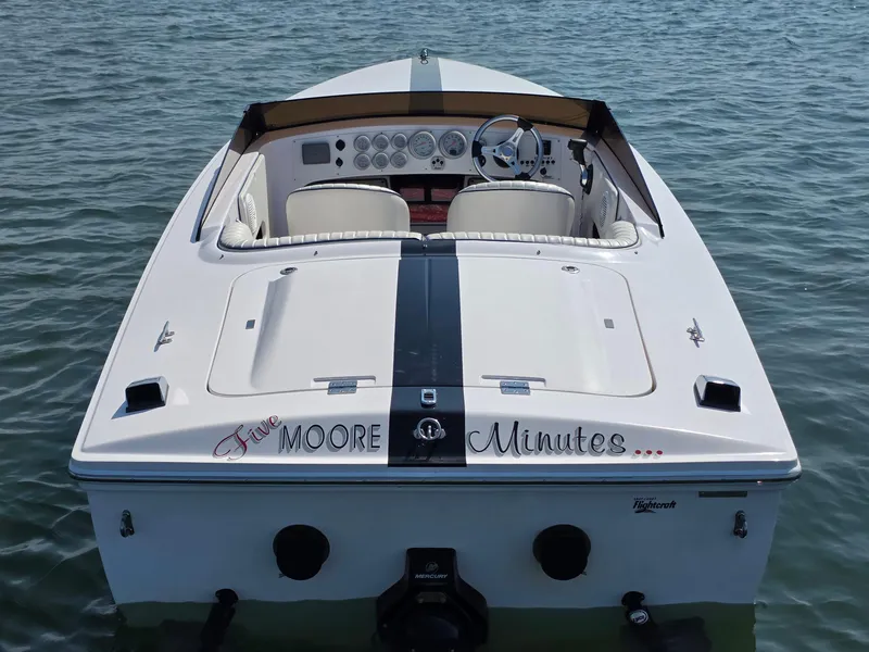 Slide: The Image of 2018 Donzi 22 Classic boat on water, rear view with custom lettering. - 3