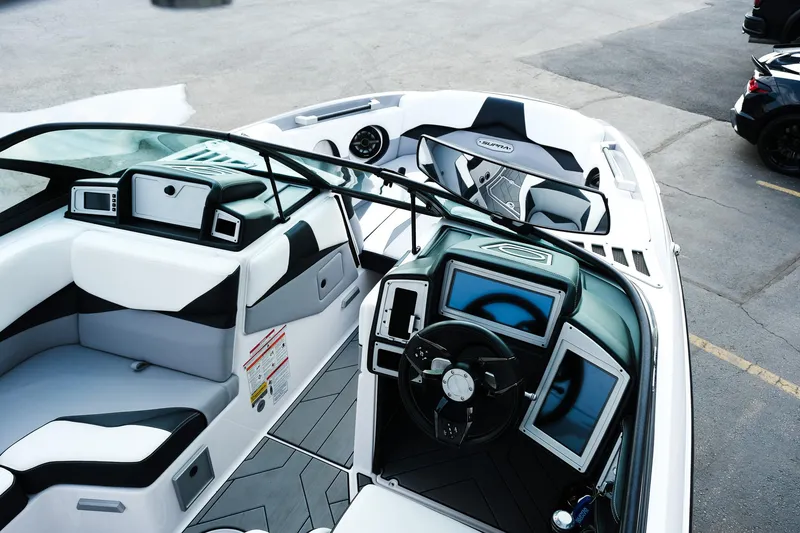 Slide: The Image of 2020 Supra SL450 boat interior with modern dashboard and seating, showcasing luxury design. - 10