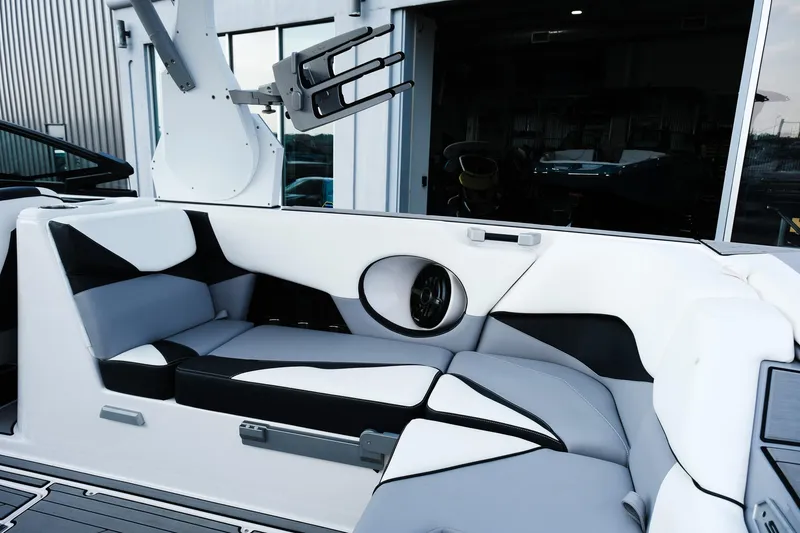 Slide: The Image of 2020 Supra SL450 boat interior with sleek white and black seating design. - 12