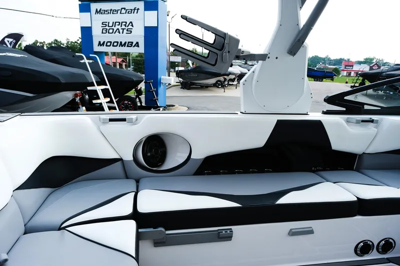 Slide: The Image of 2020 Supra SL450 boat interior with sleek seating and speaker system. - 13