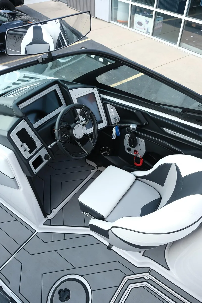 Slide: The Image of 2020 Supra SL450 boat interior with modern dashboard and sleek seating design. - 17