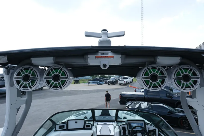 Slide: The Image of 2020 Supra SL450 boat with advanced audio system and sleek dashboard design. - 26