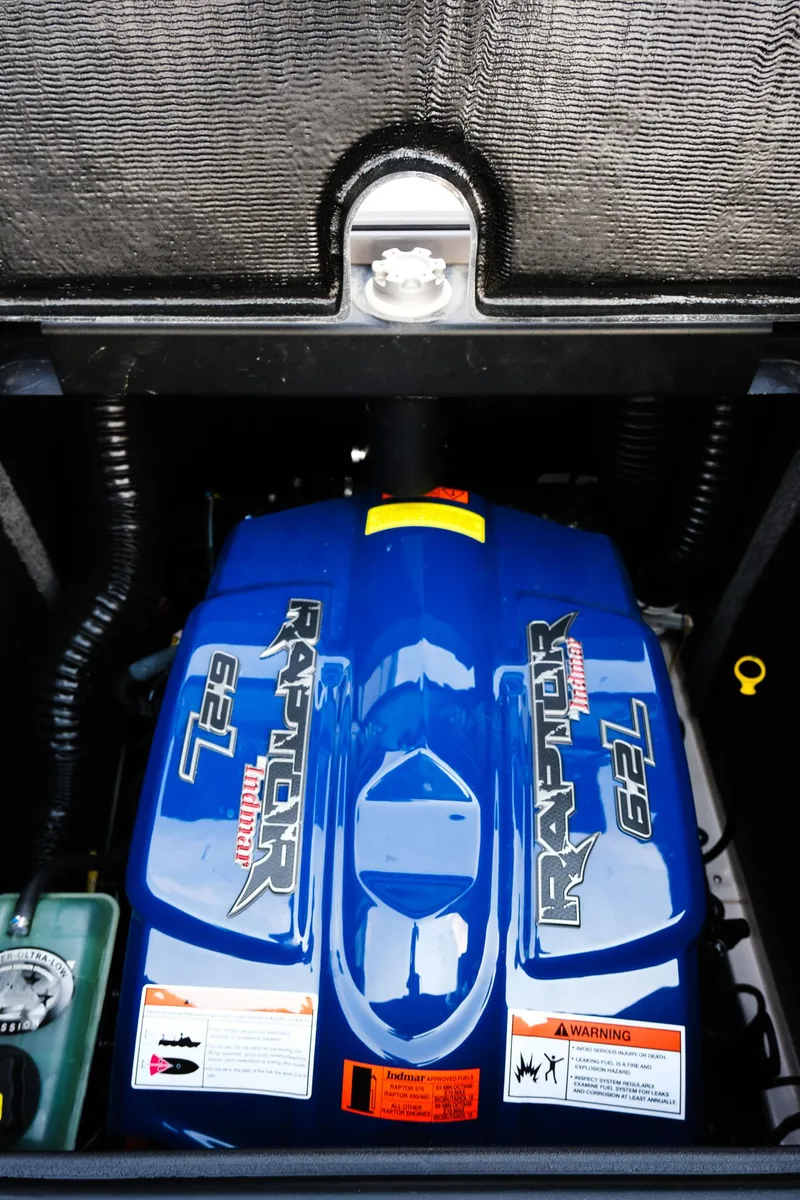 Slide: The Image of 2020 Supra SL450 engine compartment with Raptor 6.2L engine, blue cover, and warning labels. - 27