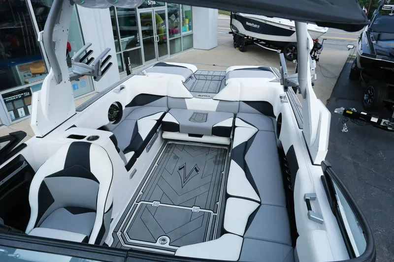Slide: The Image of 2020 Supra SL450 boat interior with sleek white and black seating, modern design. - 30