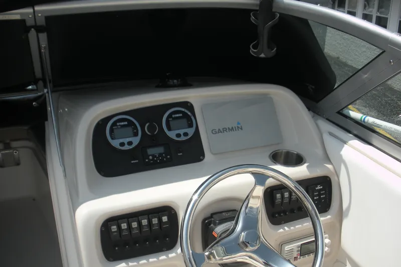 Slide: The Image of 2017 Robalo R227DC boat dashboard with Garmin navigation and Yamaha gauges. - 6