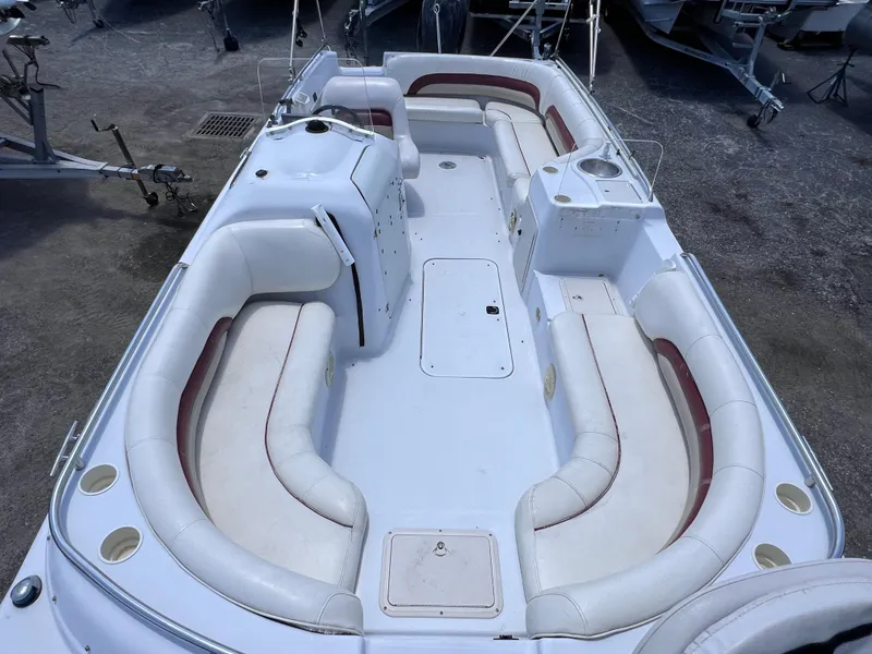Slide: The Image of 2000 Hurricane FunDeck GS 232 OB boat with spacious seating and white upholstery. - 18
