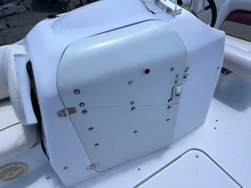 Slide: The Image of 2000 Hurricane FunDeck GS 232 OB boat console with white seating and control panel. - 20