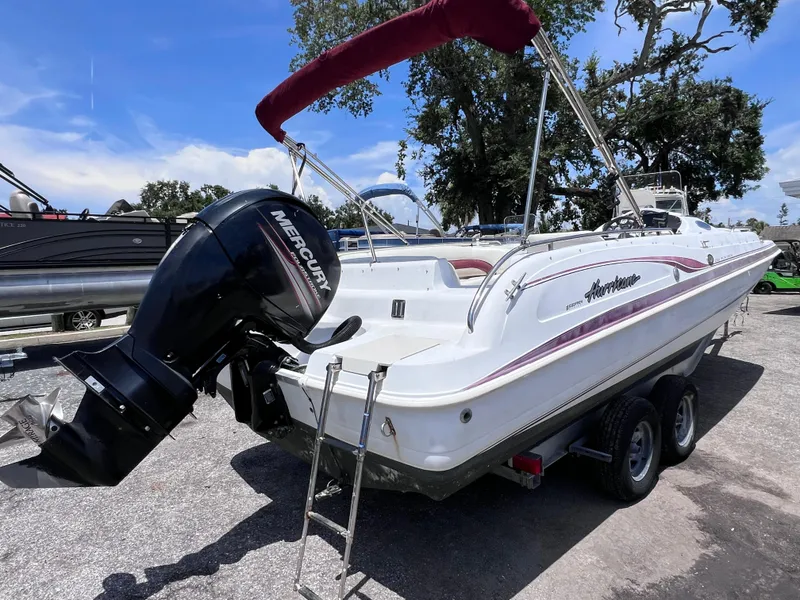 Slide: The Image of 2000 Hurricane FunDeck GS 232 OB boat with Mercury outboard motor on trailer. - 4