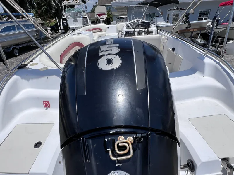 Slide: The Image of 2000 Hurricane FunDeck GS 232 OB boat with powerful outboard motor, spacious seating, and sleek design. - 6
