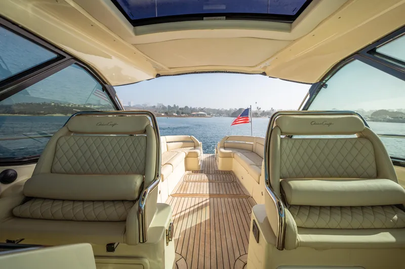 Slide: The Image of 2014 Chris-Craft Corsair 36 Hard Top interior with luxurious seating and scenic water view. - 25