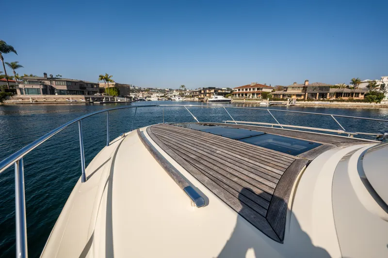 Slide: The Image of 2014 Chris-Craft Corsair 36 Hard Top yacht on a sunny waterfront. - 32