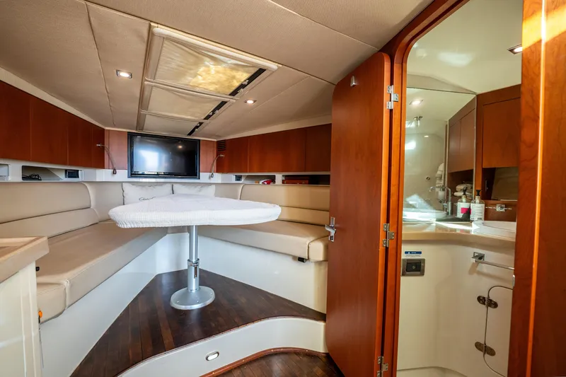 Slide: The Image of Luxurious interior of 2014 Chris-Craft Corsair 36 Hard Top yacht with seating and table. - 46