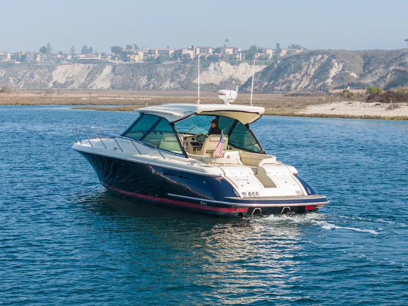 Slide: The Image of 2014 Chris-Craft Corsair 36 Hard Top cruising on a scenic waterway. - 13
