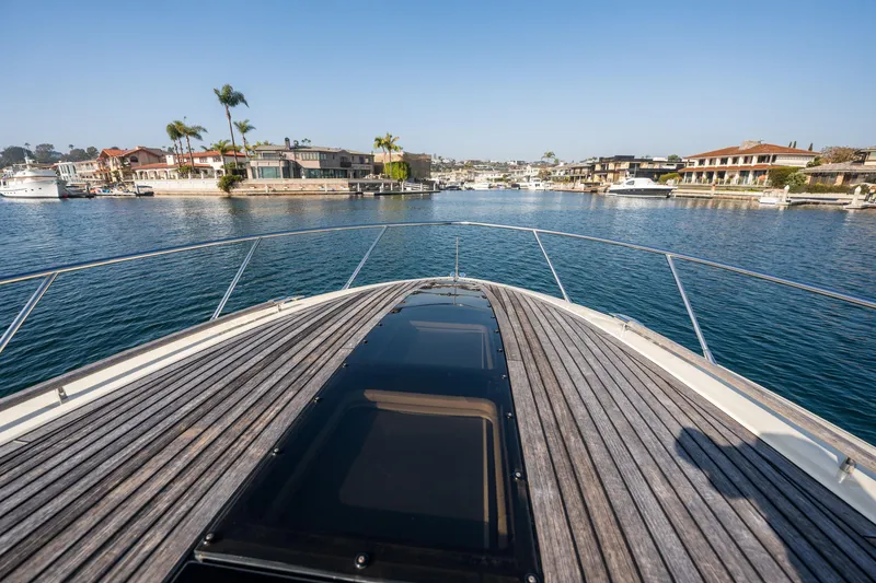 Slide: The Image of 2014 Chris-Craft Corsair 36 Hard Top cruising in a scenic marina. - 33