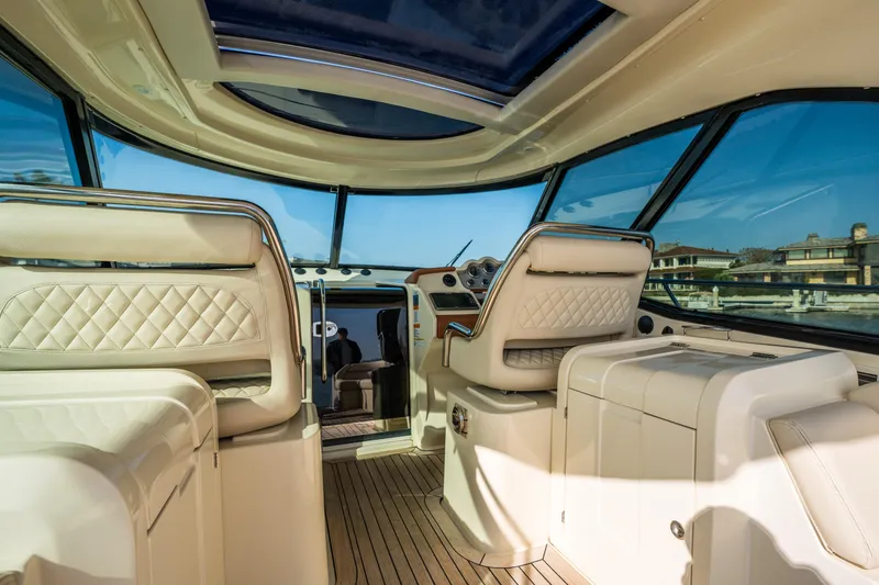 Slide: The Image of Interior of 2014 Chris-Craft Corsair 36 Hard Top with luxurious seating and panoramic windows. - 28