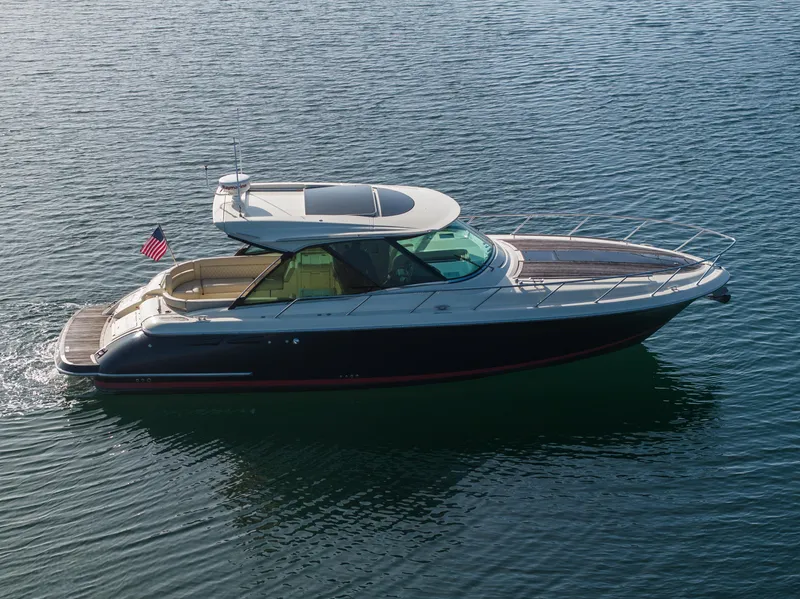Slide: The Image of 2014 Chris-Craft Corsair 36 Hard Top cruising on calm water. - 5