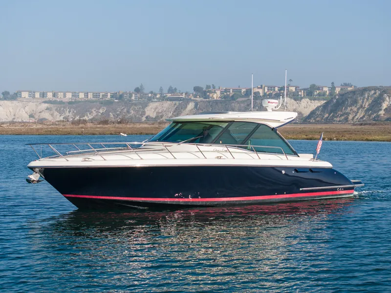 The Image of 2014 Chris-Craft Corsair 36 Hard Top cruising on calm waters. - 1