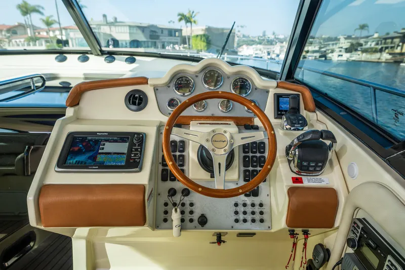 Slide: The Image of 2014 Chris-Craft Corsair 36 Hard Top helm with modern navigation instruments. - 26
