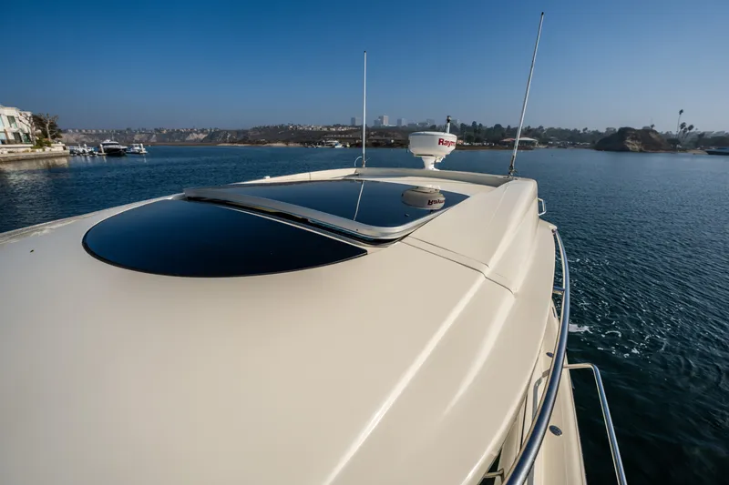 Slide: The Image of 2014 Chris-Craft Corsair 36 Hard Top yacht on serene water, showcasing sleek design. - 30