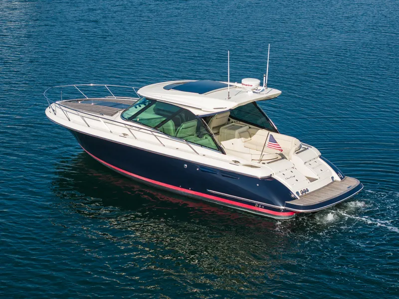 Slide: The Image of 2014 Chris-Craft Corsair 36 Hard Top cruising on calm blue water. - 8