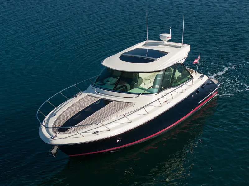 Slide: The Image of 2014 Chris-Craft Corsair 36 Hard Top cruising on calm blue water. - 2