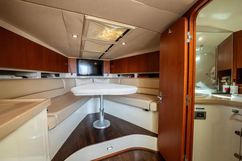 Slide: The Image of Luxurious interior of 2014 Chris-Craft Corsair 36 Hard Top yacht with seating and table. - 45