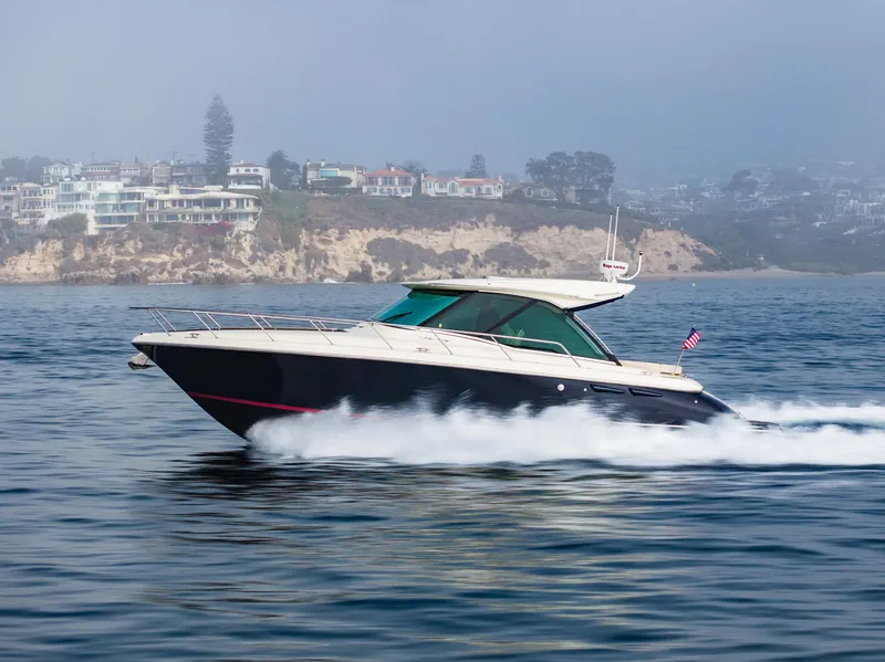 Slide: The Image of 2014 Chris-Craft Corsair 36 Hard Top cruising near coastal cliffs. - 18
