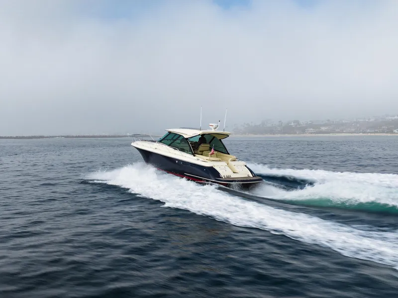 Slide: The Image of 2014 Chris-Craft Corsair 36 Hard Top cruising on open water. - 21
