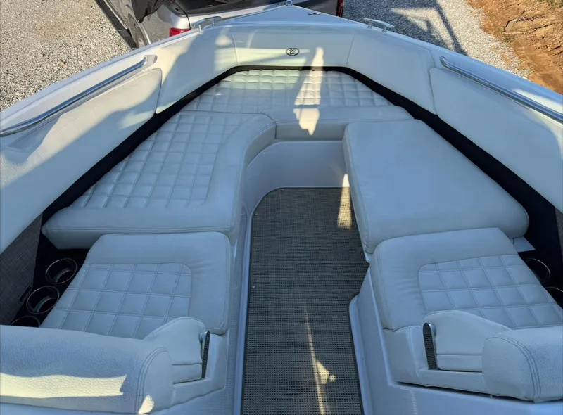 Slide: The Image of 2020 Cobalt R7 Surf boat interior with white cushioned seating and cup holders. - 3