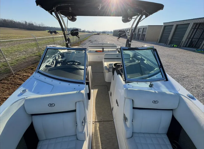 Slide: The Image of 2020 Cobalt R7 Surf boat interior with white seating and open windshield under sunlight. - 4