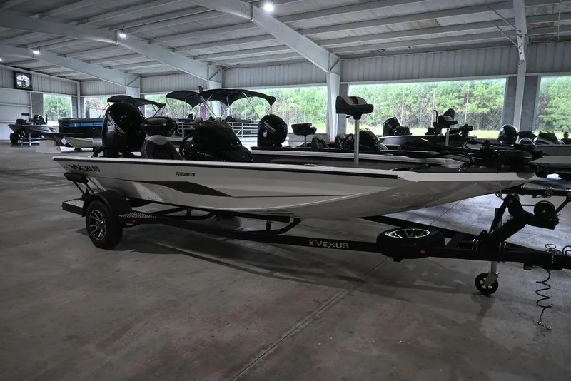 The Image of 2026 Vexus AVX181 DEFENDER boat in a showroom, featuring sleek design and modern features. - 1