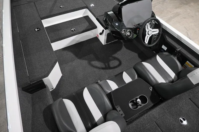 Slide: The Image of 2026 Vexus AVX181 DEFENDER boat interior with sleek seating and modern steering console. - 4