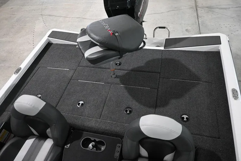 Slide: The Image of 2026 Vexus AVX181 DEFENDER boat interior with gray seating and carpeted deck. - 8