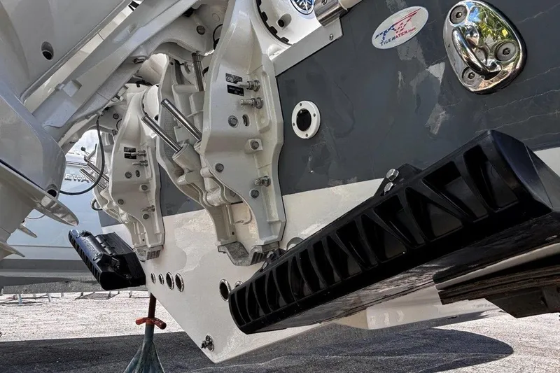Slide: The Image of 2026 Tidewater 272 LXF boat stern with dual outboard motors and trim tabs. - 11