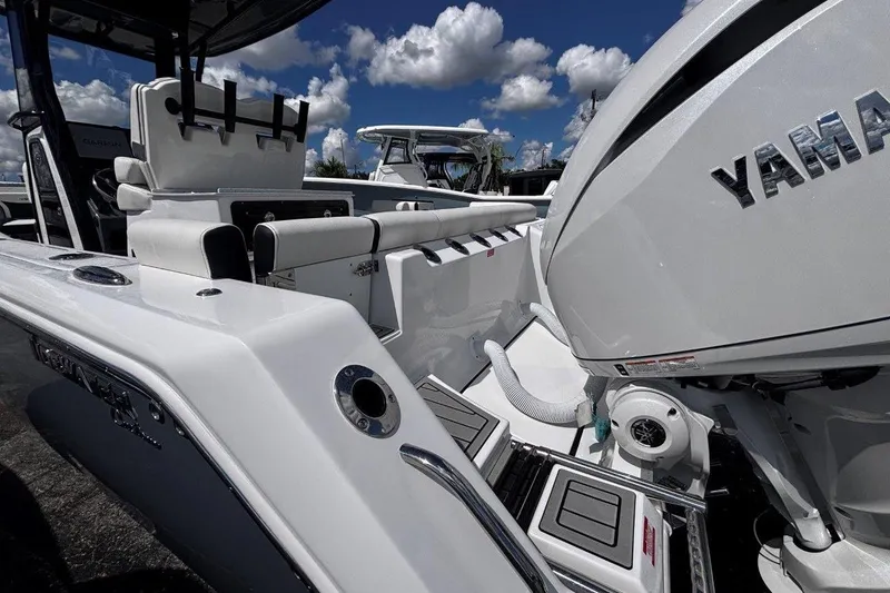 Slide: The Image of 2026 Tidewater 272 LXF boat with Yamaha engine under a blue sky. - 12