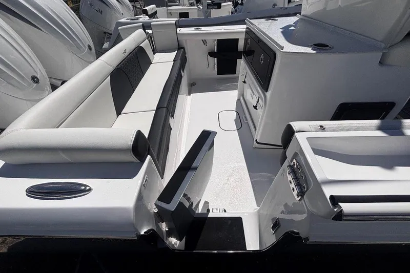 Slide: The Image of 2026 Tidewater 272 LXF boat interior with seating and storage compartments. - 14